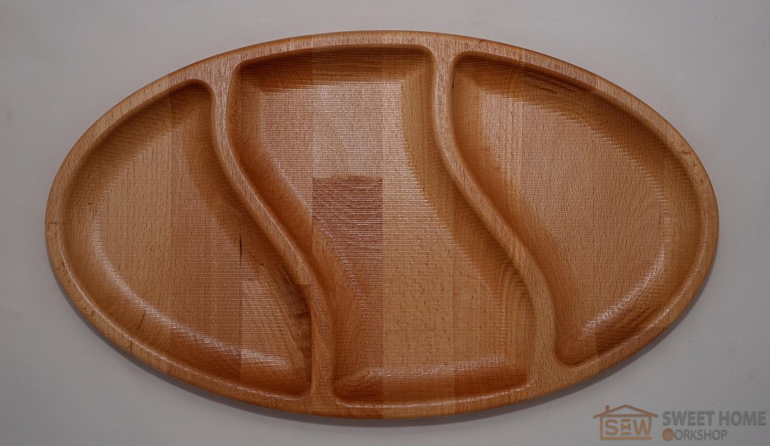 Oval dish for snacks with three compartments